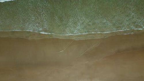 Sea Waves Breaking on Sand Beach