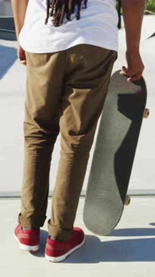 Skateboarding, start and legs in park with action, stability control and riding technique in fitness