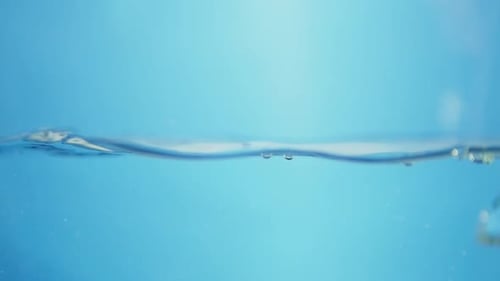Liquid Ripple Effect in Blue Water. View of Nature's Smooth Fluid Patterns.