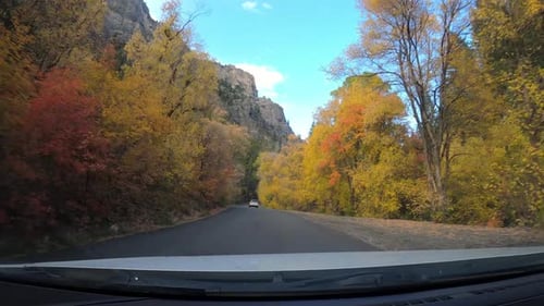 Driving through American Fork Canyon in fall, autumnal colors, dashboard cam