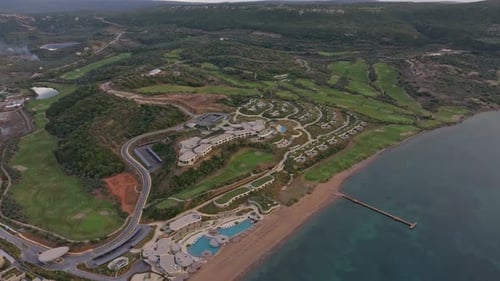 Aerial view of golf course and hotel at sunset, Greece.