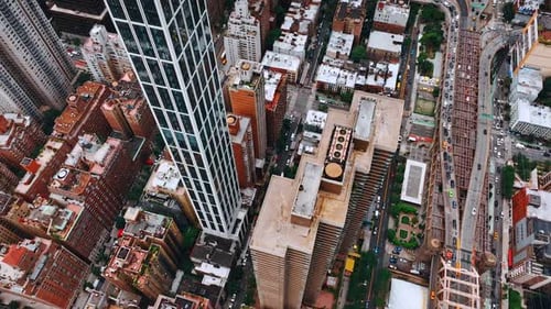 Descending over the tops of skyscrapers in New York.