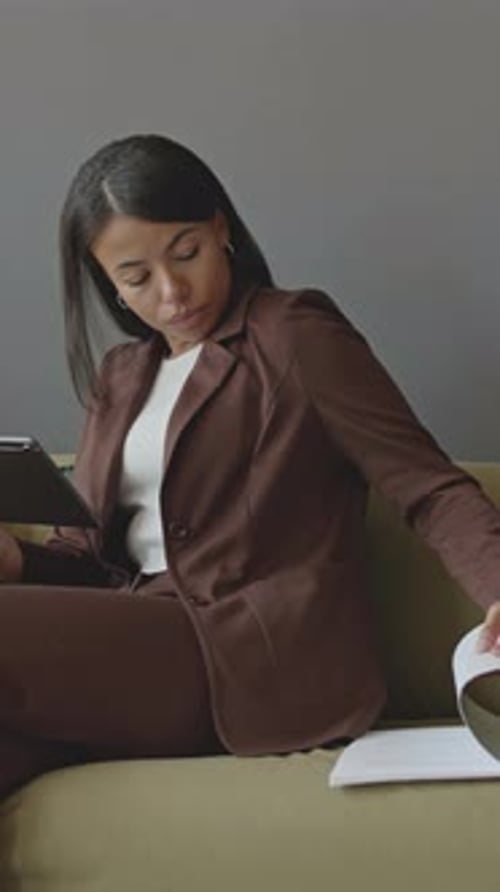 Businesswoman Working on Digital Tablet in Office