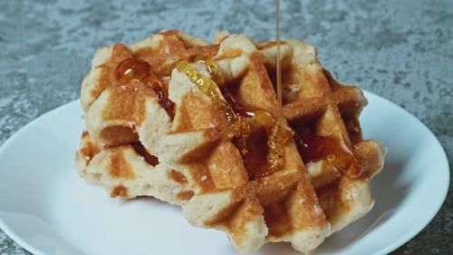 Waffles Topped with Golden Syrup Close Up