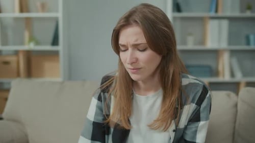 Upset Woman Takes Pill for Headaches By Drinking a Glass of Still Water at Home