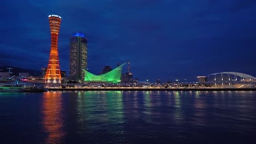 Slow pan over the skyline of port at Kobe, Japan with Kobe Port Tower
