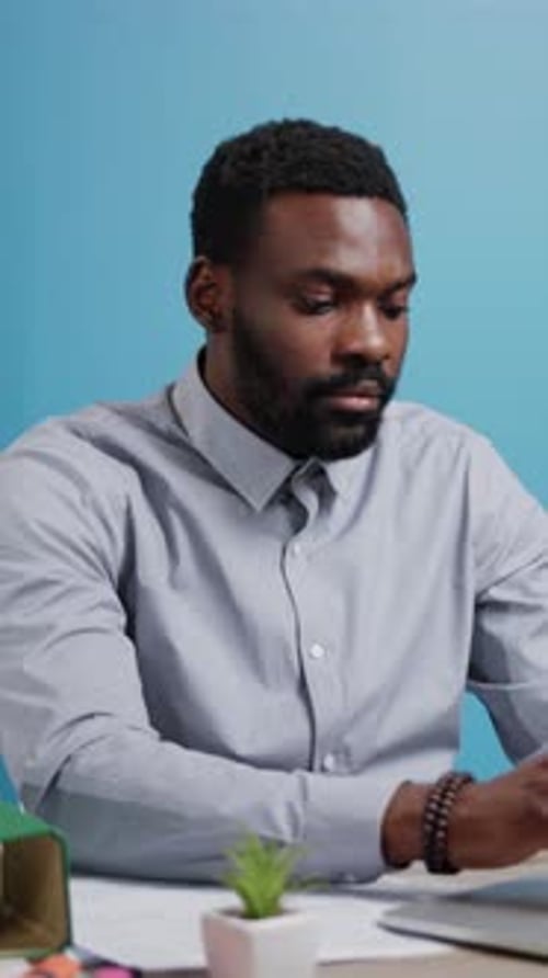 A Focused and Committed Professional Engaged in Tasks Inside a Modern Office Environment