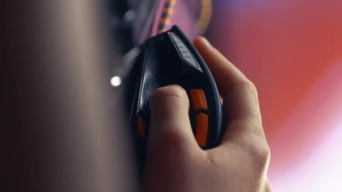 Hand Clicks Gaming Computer Mouse in Close Up