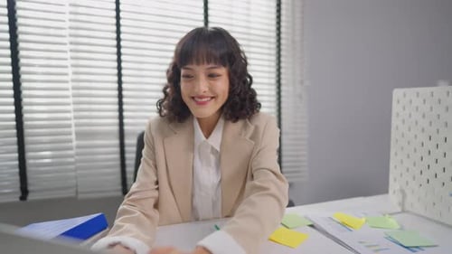 Portrait of Asian young businesswoman working in the office workplace.