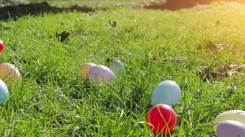 Colorful easter eggs scattered in the grass during Easter