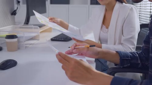 Close up of young businessman and businesswoman people work in office.