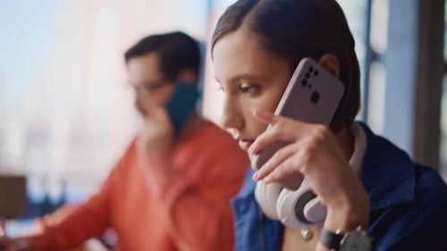 Busy Professionals Working at Laptop and Talking on Phone