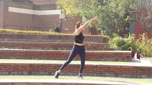 Video of slim girl performing full body weight loss exercise.