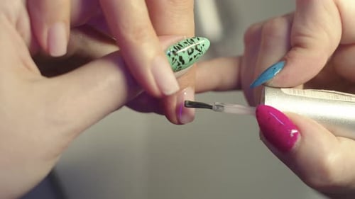 Close up of Woman Painting Nails