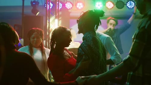 Young People Enjoying Nightlife at Dance Party