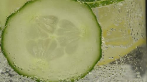 Cucumber and Lemon Slices in Sparkling Water Close-up