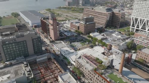 Aerial tilt down of Williamsburg neighborhood along Brooklyn's waterfront