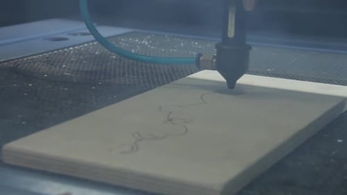 Laser Engraver Etching Design into Wood
