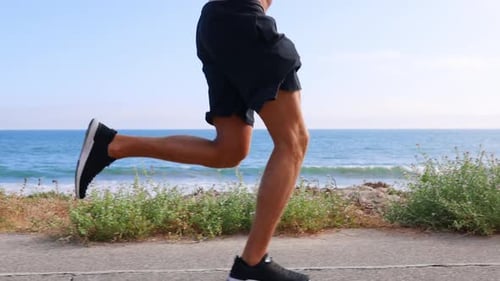Athletic Man Exercising At The Beach