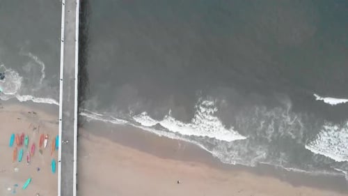 4k Aerial Top down Crane moving Down shot of a Shipping Port Pier on a Sunrise with monsoon clouds c