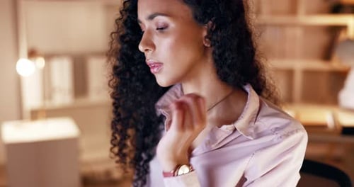 Woman Rubbing Neck Inside Workplace