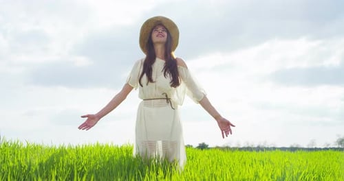 Beauty Girl with Healthy Long Hair Outdoors. Happy Smiling Young Woman Enjoying Nature. Beautiful