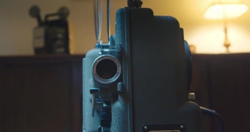 Hand Adjusting Settings on Vintage Film Projector