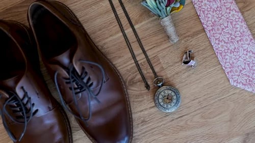 Wedding details. Groom accessories. Shoes, cufflinks, belt, watch, boutonniere