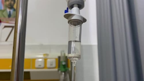 close up of a intravenous drip hose on the ward room. IV drip tubes in a hospital room