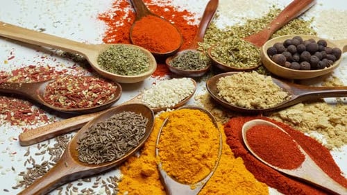 Assorted Dried Herbs and Spices in Wooden Spoons