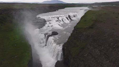 Aerial View of Gullfoss Waterfall Cascading Into a Rugged Canyon