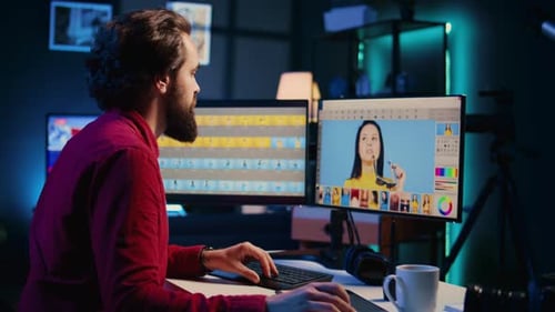Man Editing Video at Desk in Modern Office