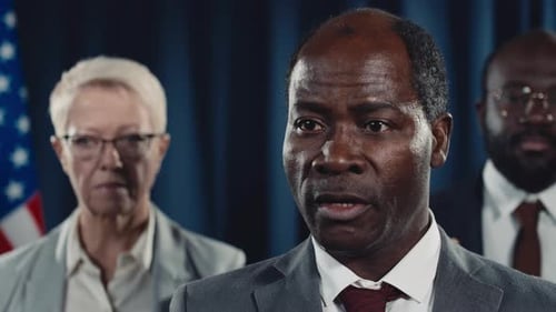 Man Giving Speech at Press Conference