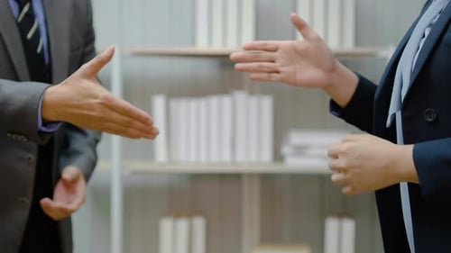 Close up business people handshake and in meeting in office for celebration, congratulations