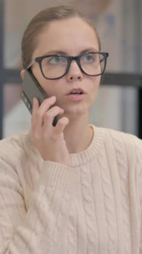 Young Woman Talking on Smartphone
