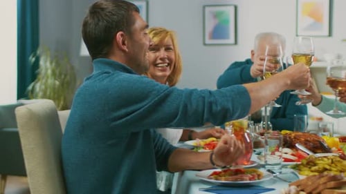 Family Celebrates Together Around a Meal with Wine