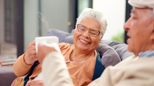 Senior Couple Relaxing and Drinking Tea at Home