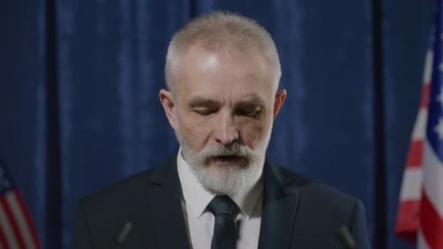 Man at Podium Giving Formal Speech