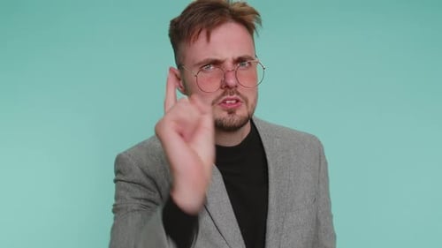 Adult Gesturing in Front of a Blue Background