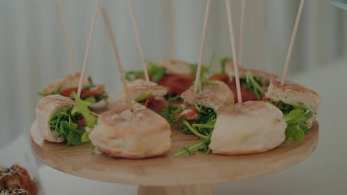 fresh mini sandwiches served on wooden stand