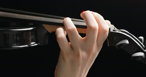 Violin Playing Close Up on Black
