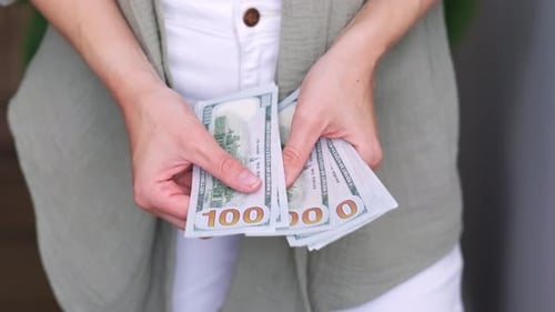 Showing Cash Money 1000 American Dollars Banknotes Close Up in Woman Hands Income Winner and