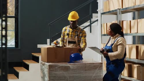 Warehouse Employees Packaging Boxes for Shipping