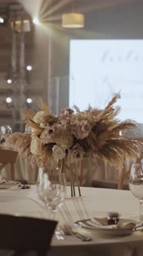 A Beautifully Decorated Banquet Hall for a Wedding Reception Table Setup Flower Vertical Video