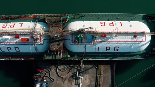 Aerial Top Down View Ship LPG Tanker Vessel Loading in Gas and Oil Terminal Station Refinery Global