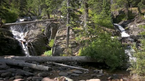 Wide view of Twin Falls at Two Medicine Lake in Glacier National Park, static