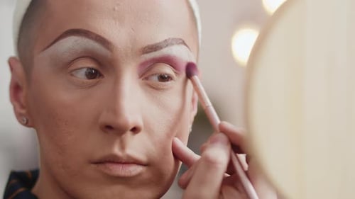 Makeup Artist Applying Eye Shadow Close Up