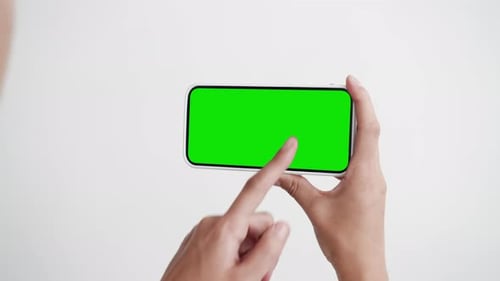 Young Woman Touch Smartphone with Green Screen Chroma Key Closeup POV