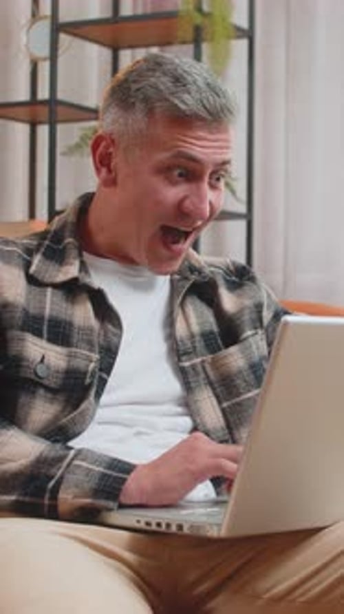 Man is Shocked while Using his Laptop