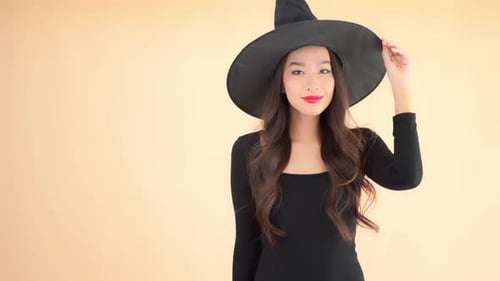 Girl in Witch Costume with Witch Hat Smiling